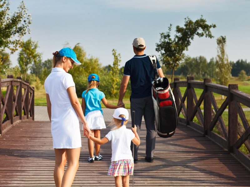 bigstock-Family-Of-Golf-Players-Walking-82259504